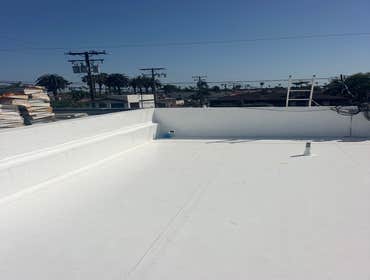 Long Beach Commercial Roofing System - Mechanically attached 50 MIL single-ply PVC IB Roofing System on Ace Billings Paint & Hardware.