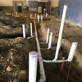 Photos by Avila Engineering & Construction LLC Place all the U/G Pipe, Level and grading the area, and place the Slab On Grade for this commercial proj