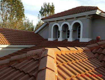 Photos from Popa Construction LLC Before & Afters of a soft wash roof cleaning and driveway and side walk cleaning.