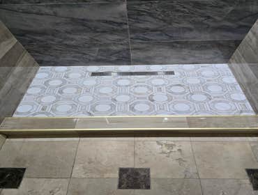 Photos by MC ALISTER TILE #1 5 showers total, was hired after another handyman did not water proof correctly, fixed all water proofing and installed 