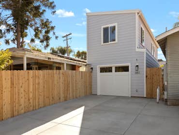 Custom ADU This custom ADU was built over an existing 110 year old garage. The garage was expanded and added on to to create an office and studio space