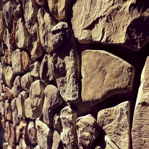 privacy wall restoration These pictures are of two privacy walls around outdoor patios that were in horrible disrepair. the stones were falling off...