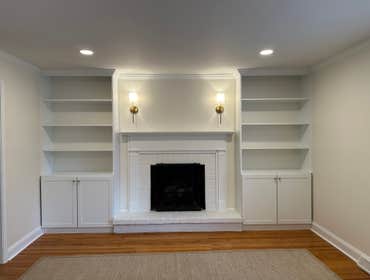 Photos by General remodeling #2 Family Room remodel. We installed two custom built in base cabinets with custom shelves. We installed new crown molding