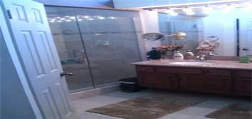 Custom Designed Bathroom Renovation New Walk in Shower, Granite Counter, Tile Floors, and Cabinet Reface.