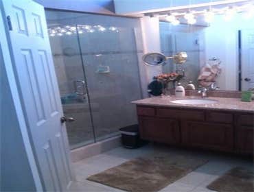 Custom Designed Bathroom Renovation New Walk in Shower, Granite Counter, Tile Floors, and Cabinet Reface.