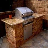 various projects Elegant outdoor dining with this three rivers flagstone semi-circle bench. Constructed of concrete block and 3’ natural gas fire pit f