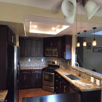 Kitchen remodel Full kitchen remodel. Demolished and relocated partition walls, relocated Plumbing, electrical and relocated Washer and Dryer into gara