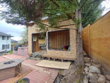Photos by Stewart & Son Gate & Fence LLC #1 Tiny House with pergola. Small house 17' by 12' small bathroom with pocket door, and small sink with water 