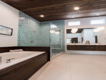 Photos by Monkey Wrench plumbing, Heating & Air #1 Complete remodel of mid-century modern home. Also added a half bath on main level as well as a secon