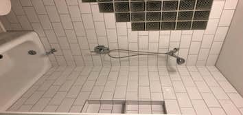 Brand new tile, niche, shower valve and tub.