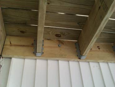 Photo(s) from Laur Moor Construction Two decks and a tiled kitchen floor