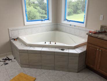 Photos by Gene Calabrese Remodeling & Renovations #9 Complete remodel of a traditional bathroom to a contemporary one. Adding 12”x24” porcelain tile ap