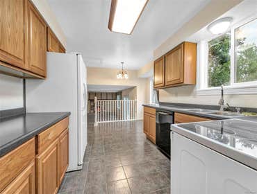 Photos by KM Services #2 Took out all carpet, painted floors with KILZ. Repaired damage to walls and trim, sprayed 9 rooms and trim...2 days after fini
