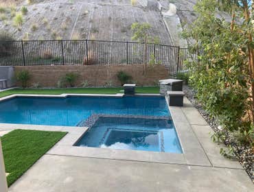 Photos by Building Greatness Inc #1 This project intakes a remodel for the pool including plaster, tiles and the jacuzzi. The front and backyard we add