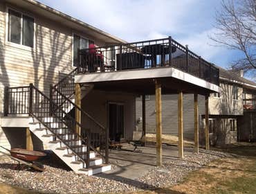 Photos by Custom Home Specialties Inc #2 Timber Tech maintenance free decks with powder coated railings.