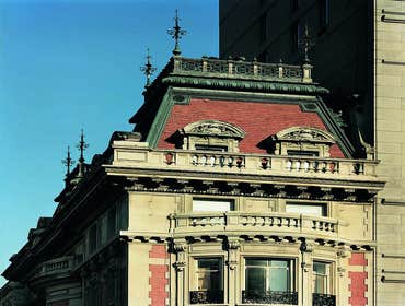 Benjamin Duke House Reproduction of the forged iron finials and copper balustrade atop the mansard roof.
