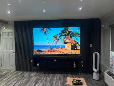 Custom flush wall surround sound — hidden speakers.