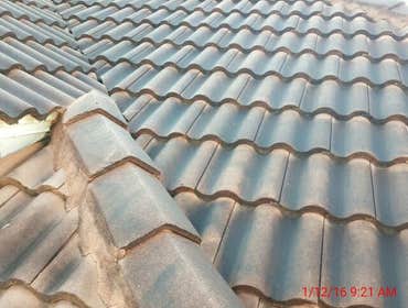 Photos from Popa Construction LLC Before & Afters of a soft wash roof cleaning and driveway and side walk cleaning.