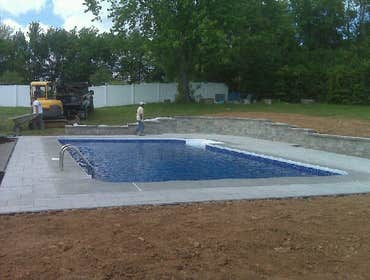Photos by Dunn Landscape Construction #1 After initial pool installation provide all hardscape including retaining walls, pool deck, walkways and plant