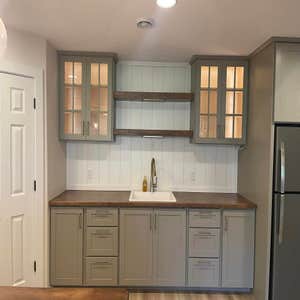 Basement Finishing W?W - this basement is a showstopper! Check out the beautiful wet bar ? with pantry; it is the highlight! ? This basement...