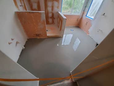 Discovered grossly uneven floors so used self-leveling agent to prep for LVP