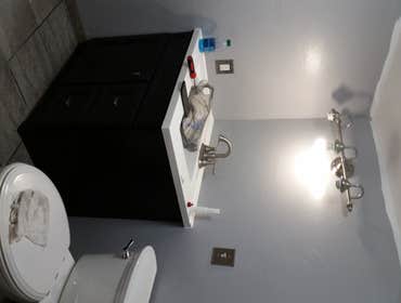 Photos by Demo & Renovation Services, LLC #6 Converted office/work area into handicap accessible master bathroom. Included new plumbing for full bathr