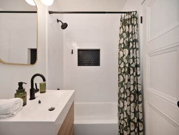 Simple Minimalistic Bathroom Remodel in Carmichael, CA 95608 This bathroom remodel achieves a trendy aesthetic that feels both warm and minimalist. The