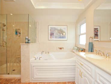 Master Bathroom This bathroom was completely gutted. We installed a large Trajet jetted bathtub, oversized shower, custom vanity, recessed lighting, n