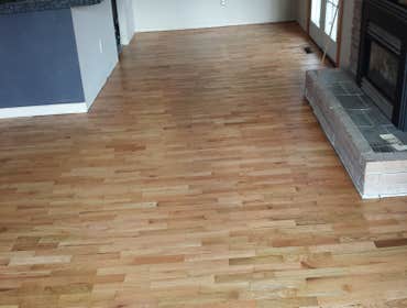 Hardwood flooring refinish Red oak sanded and aply 3 coats of swidish finish natural on it.