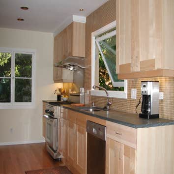 Bath Remodel This kitchen remodel, designed by John Wheatman and Associates, features clean lines and a contemporary feel.
