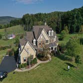 Exterior Photos Exterior painting of a large home in Bucks County, PA. Included painting of stucco siding using an elastomeric coating, as well as pain