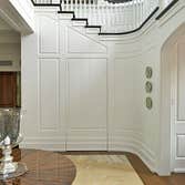 Project photos from Toby Leary Fine Woodworking, Inc. Interior Millwork Osterville, MA.
Coffered ceiling, curved paneling, window trim, hidden door.