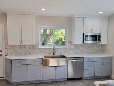 Photos by M&c Global Construction LLC #8 We completed a full kitchen remodel in Baltimore, MD, transforming the space with modern design, improved func