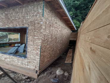 Photos by Stewart & Son Gate & Fence LLC #1 Tiny House with pergola. Small house 17' by 12' small bathroom with pocket door, and small sink with water 