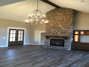Photos by Thomas Elliott #1 2100 sf home with partially finished pre-cast concrete basement. This home has wood flooring, custom woodwork, tile and cab