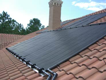 Pool Solar Installation This is a pool solar system that was installed on a barrel tile roof.