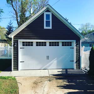 Photos by A-Windy City Garage Corporation #3 New garage construction with storage loft. Hardie siding and upgraded garage doors and windows.
