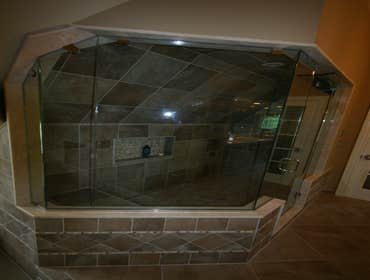 Scandone House This is a new construction home tile and marble installation custom kitchen and bath work.Custom marble in main foyer, custom work throu