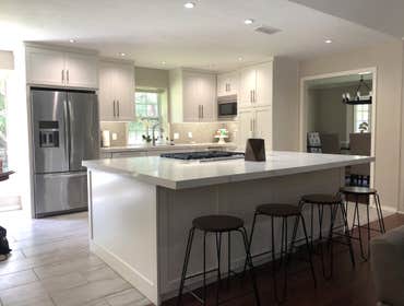 Plano Kitchen Remodeled existing kitchen, opening the floor plan up, installing all new cabinetry, countertops, flooring, and lighting.