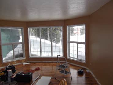Interior/exterior painting and staining three bedroom house, installing trims, complete repainting (7 colors),