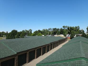 Carefree Storage Facility in Fridley Re-roof, custom fascia, and guttering on large commercial project.