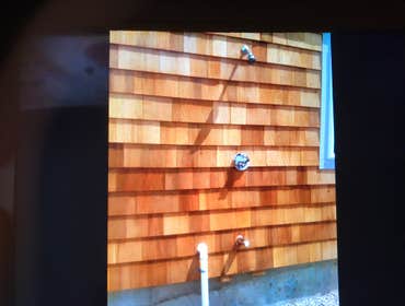 Custom out door shower pipes are hidden for pretty plumbing