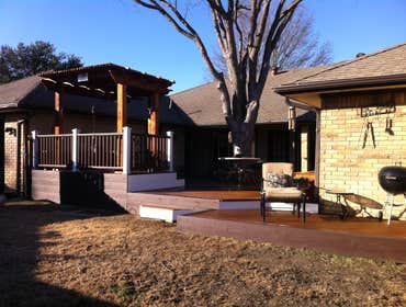 Custom composite deck with cedar arbor, amenities Custom Trex deck, multi level, with raised cedar arbor dining area, three cedar side planter boxes, b