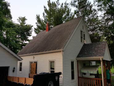 IL-15133 Removed a layer of wood shake, Added Ridge Vent, Free Upgrade To Architectural Shingles, Re-decked, Extra Ice & Water Used, New Shingles