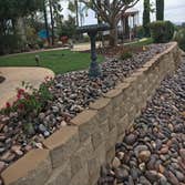Epstein Keystone Blockwall with Cobble stone mulch
