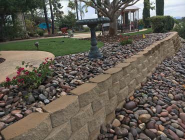 Epstein Keystone Blockwall with Cobble stone mulch