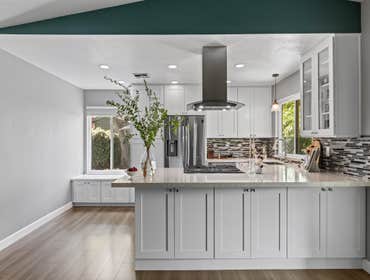 Coastal Flair Kitchen Remodel with Linear Glass Tile in Citrus Heights, CA 95610 This kitchen renovation created a bright, visually dynamic space with 