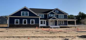 Photos by Journey Homes, LLC #3 Custom home with full landscaping and custom kitchen with heated garage