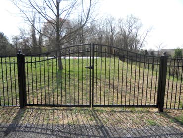 Sentinal black aluminum in Malvern This is a beautiful 54 inch black aluminum fence with swing out self closing estate gates with magnetic latches. Al