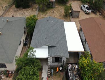 Photos by Jm Flores Roofing and Construction Inc #1 Install new 3-tab fiberglass composition shingles.
Install new white 60-mil TPO membrane fully adh